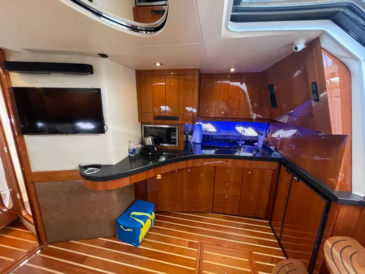  Yacht Photos Pics Luxurious 2010 Regal 44 Sport Coupe yacht interior with modern kitchen and entertainment area.