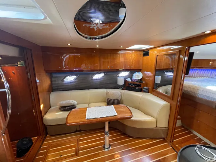  Yacht Photos Pics Luxurious interior of 2010 Regal 44 Sport Coupe yacht with elegant wood finishes.