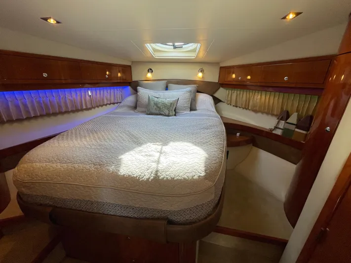  Yacht Photos Pics Luxurious bedroom interior of 2010 Regal 44 Sport Coupe yacht with elegant bedding.