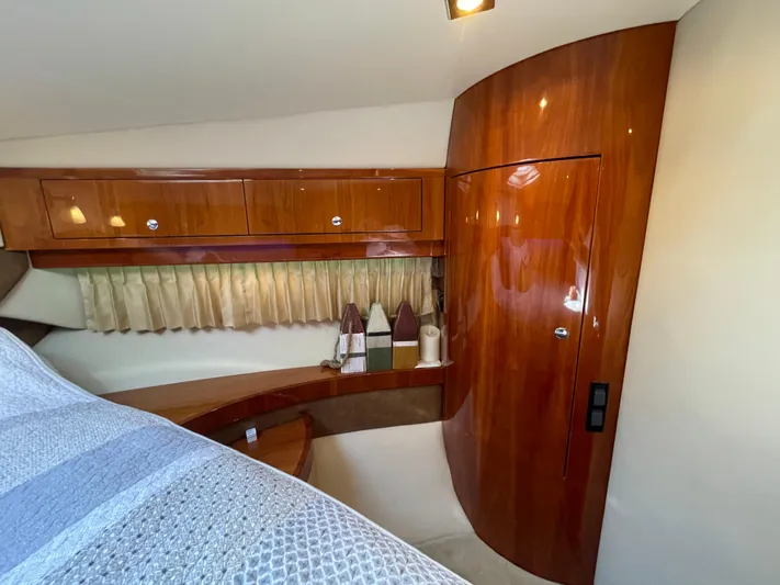  Yacht Photos Pics Luxurious interior of 2010 Regal 44 Sport Coupe with polished wood finish.