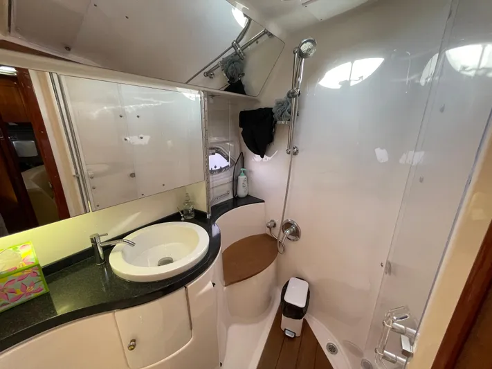 Yacht Photos Pics 2010 Regal 44 Sport Coupe bathroom with sink, shower, and modern fixtures.