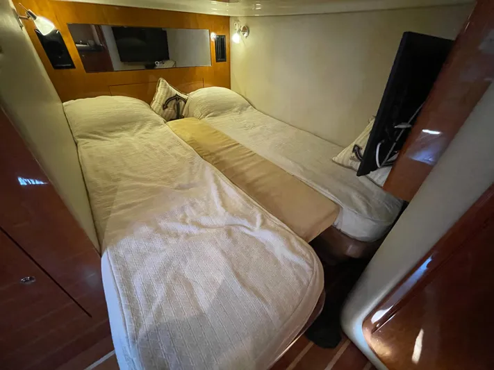  Yacht Photos Pics 2010 Regal 44 Sport Coupe cabin with twin beds and modern decor.