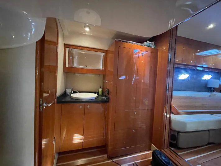  Yacht Photos Pics Luxurious interior of 2010 Regal 44 Sport Coupe yacht with wood finishes and modern amenities.