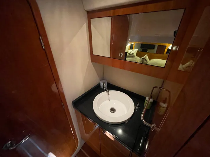  Yacht Photos Pics Luxurious bathroom in 2010 Regal 44 Sport Coupe yacht with modern sink and mirror.