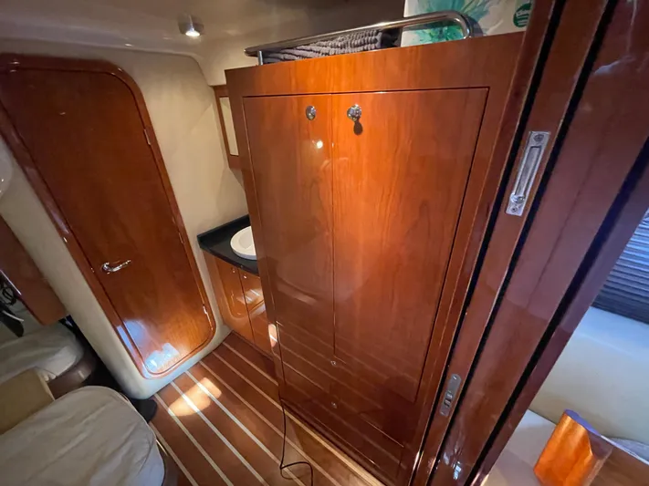  Yacht Photos Pics Interior of 2010 Regal 44 Sport Coupe with wooden cabinetry and sleek design.