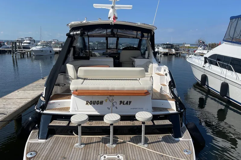  Yacht Photos Pics 2010 Regal 44 Sport Coupe yacht docked at marina, rear view.
