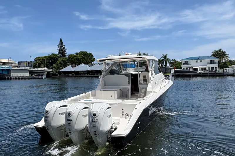 Lieuanna Yacht Photos Pics 2024 Pursuit OS 355 Offshore boat with triple Yamaha engines on a sunny day.