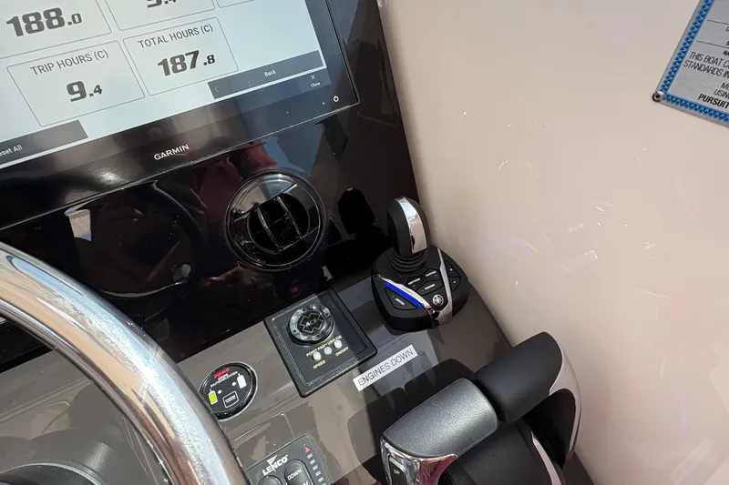 Lieuanna Yacht Photos Pics 2024 Pursuit OS 355 Offshore boat dashboard with Garmin display and control panel.