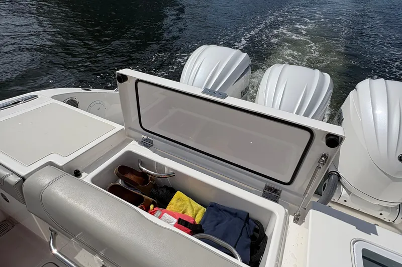 Lieuanna Yacht Photos Pics 2024 Pursuit OS 355 Offshore boat with open storage compartment and powerful outboard engines.