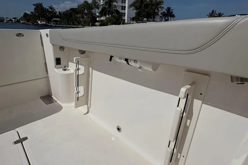 Lieuanna Yacht Photos Pics 2024 Pursuit OS 355 Offshore boat interior with sleek seating and storage features.