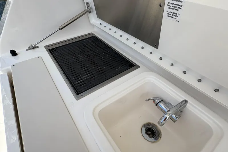 Lieuanna Yacht Photos Pics 2024 Pursuit OS 355 Offshore boat grill and sink setup.