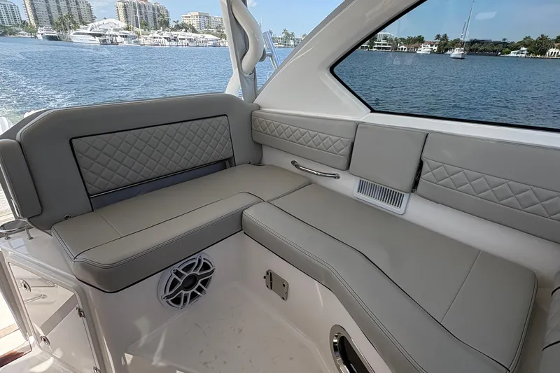 Lieuanna Yacht Photos Pics Luxurious seating on 2024 Pursuit OS 355 Offshore boat with waterfront view.