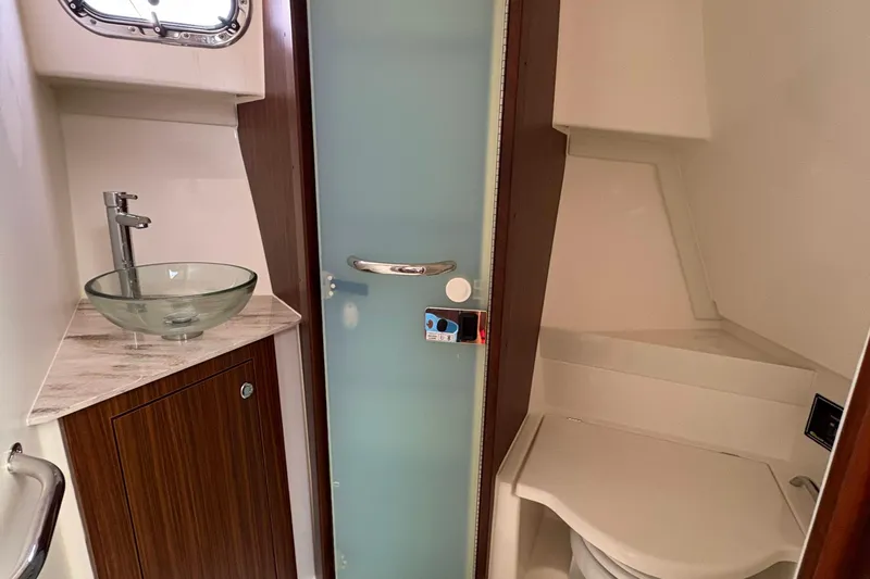 Lieuanna Yacht Photos Pics 2024 Pursuit OS 355 Offshore bathroom with glass sink and modern fixtures.