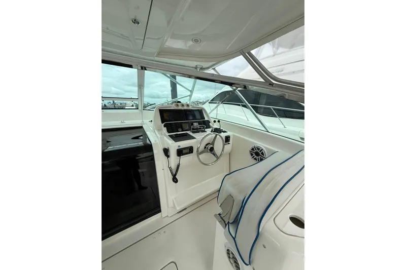  Yacht Photos Pics 2009 Bertram 390 yacht helm with steering wheel and navigation equipment.