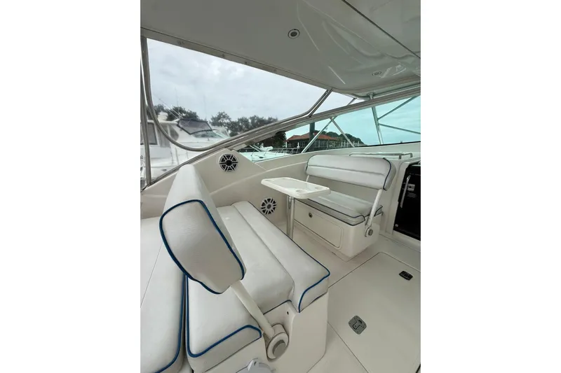  Yacht Photos Pics 2009 Bertram 390 boat interior with white seating and table.