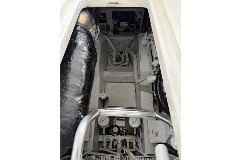  Yacht Photos Pics Engine compartment of a 2009 Bertram 390 boat, showing mechanical components and piping.