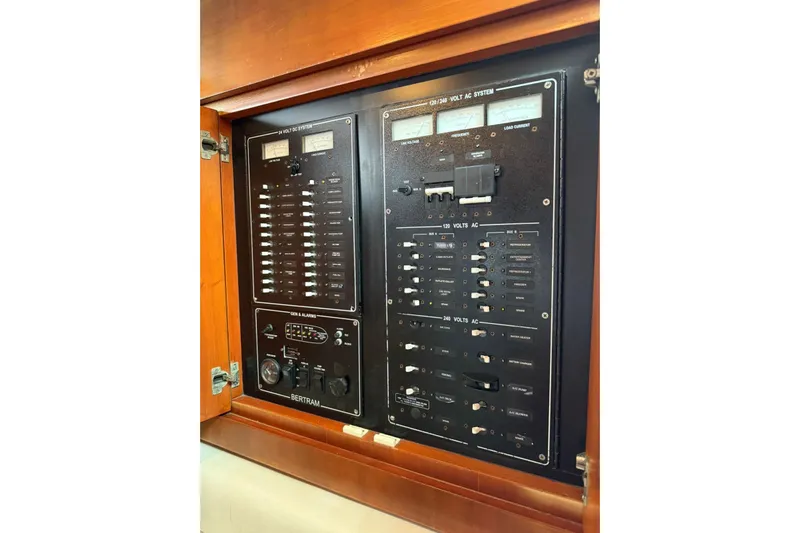  Yacht Photos Pics Electrical control panel on a 2009 Bertram 390 yacht, featuring various switches and meters.