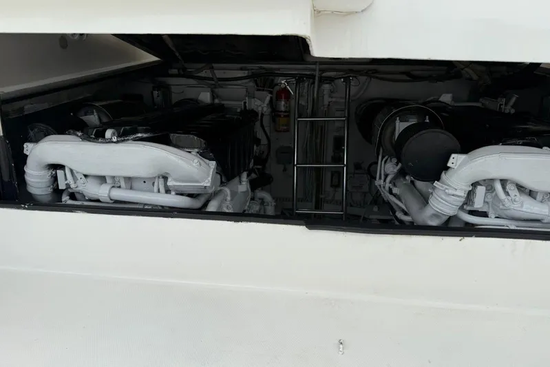  Yacht Photos Pics Engine compartment of a 2009 Bertram 390 boat, showcasing dual engines.