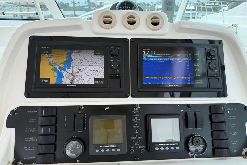  Yacht Photos Pics Control panel of a 2009 Bertram 390 boat with Garmin navigation displays.