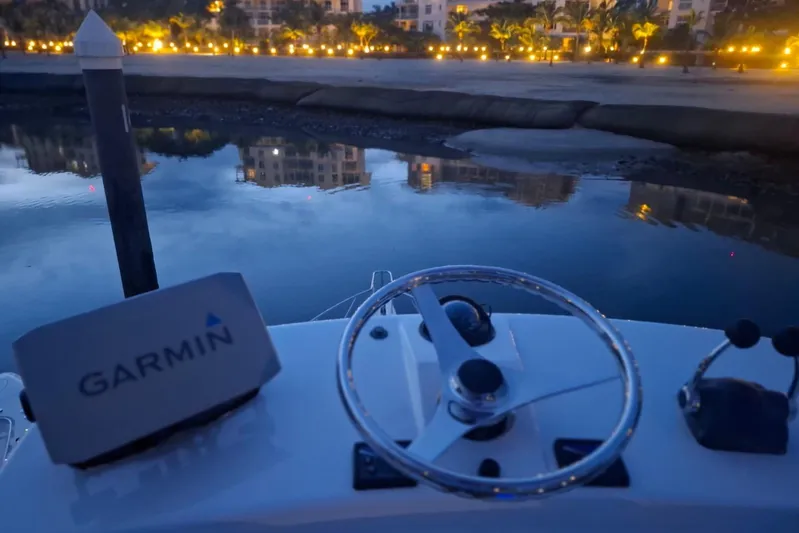  Yacht Photos Pics Bertram 390 boat helm with Garmin GPS, evening waterfront view, 2009 model.