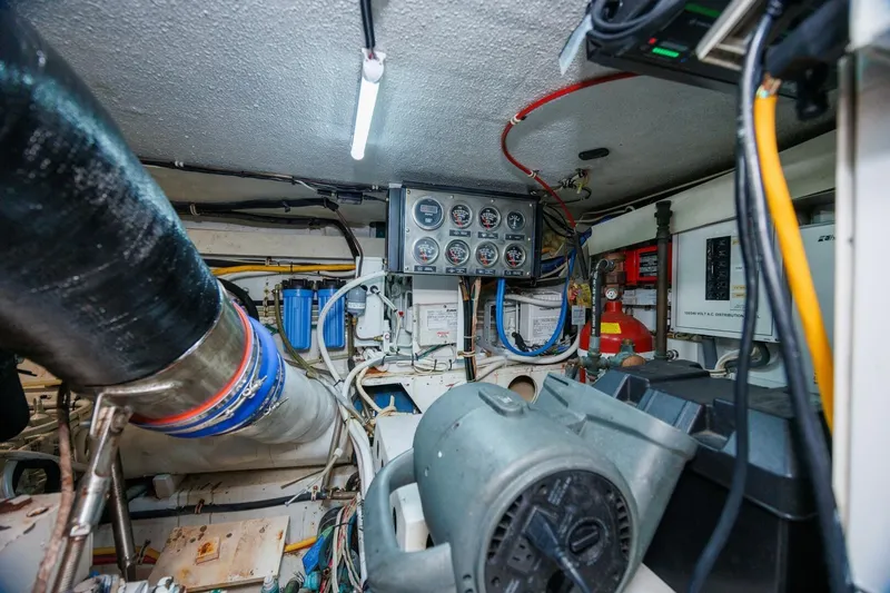 Loca Louise Yacht Photos Pics Engine room of 2002 Hatteras 50 Convertible yacht with gauges and wiring.