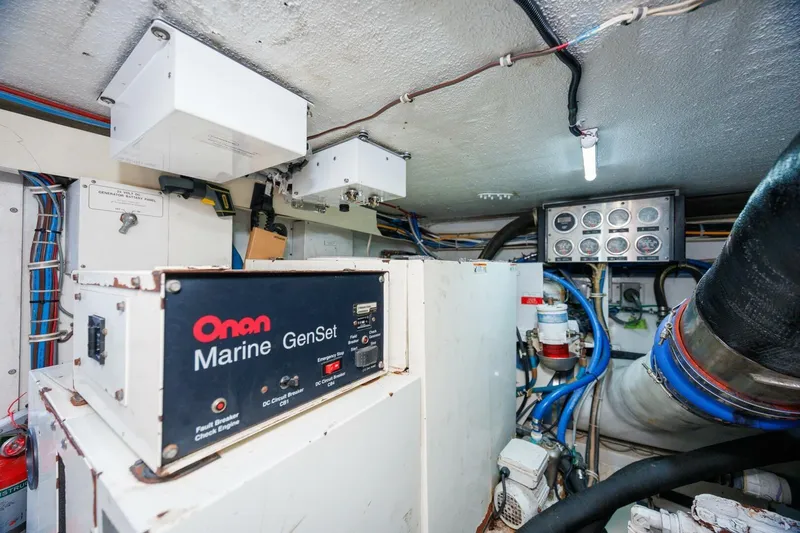 Loca Louise Yacht Photos Pics Engine room of 2002 Hatteras 50 Convertible with Onan Marine GenSet.