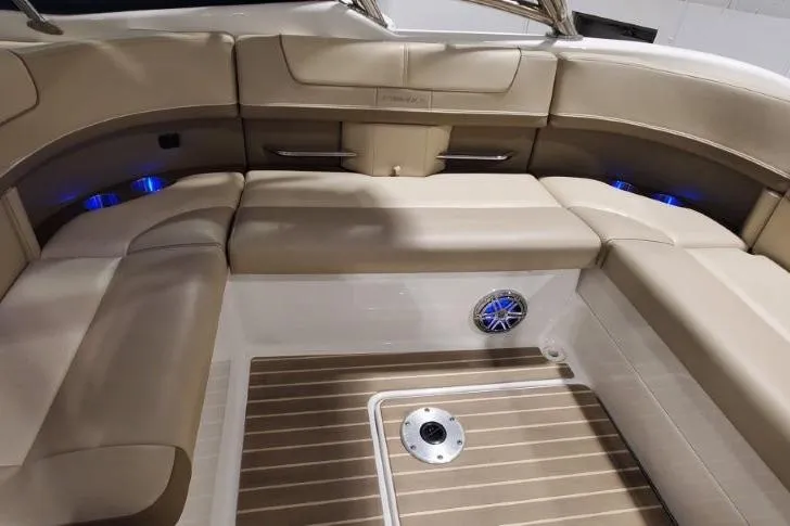  Yacht Photos Pics 2017 Formula 350 Crossover Bowrider interior with beige seating and wood-style flooring.