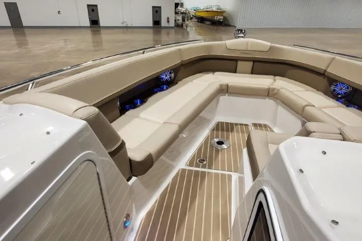  Yacht Photos Pics 2017 Formula 350 Crossover Bowrider interior with beige seating and wood flooring.