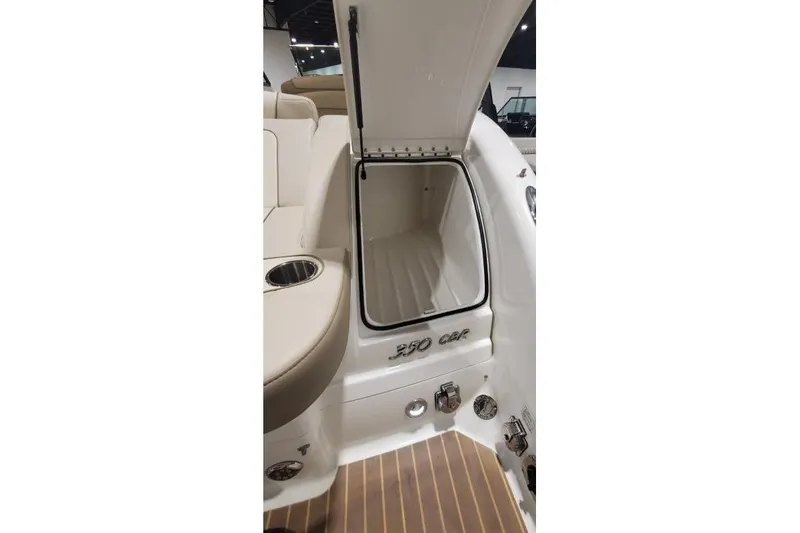  Yacht Photos Pics 2017 Formula 350 Crossover Bowrider storage compartment with open hatch and seating area.