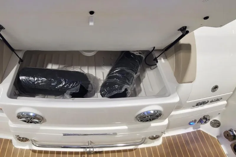  Yacht Photos Pics 2017 Formula 350 Crossover Bowrider storage compartment with wrapped items inside.