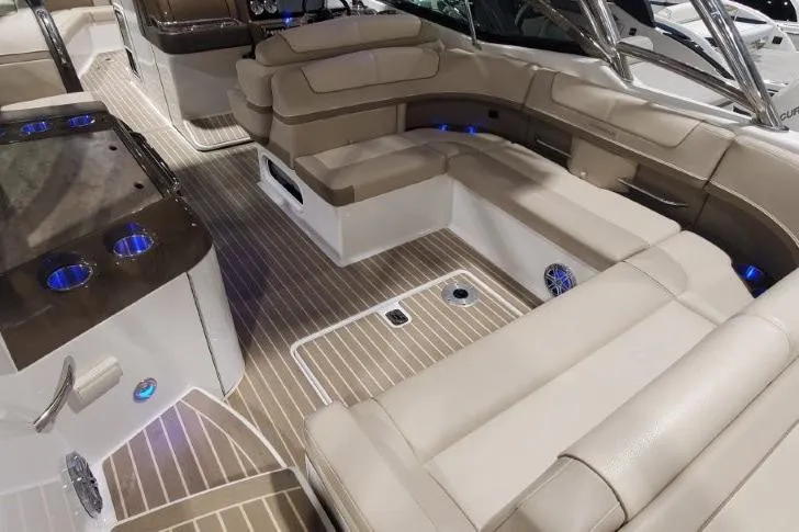  Yacht Photos Pics Luxurious interior of 2017 Formula 350 Crossover Bowrider with beige seating and wood flooring.