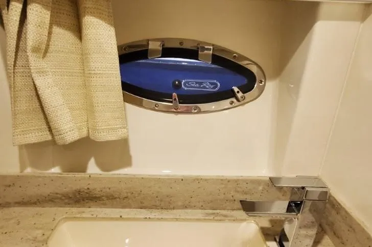  Yacht Photos Pics Bathroom interior of a 2017 Formula 350 Crossover Bowrider with porthole window.
