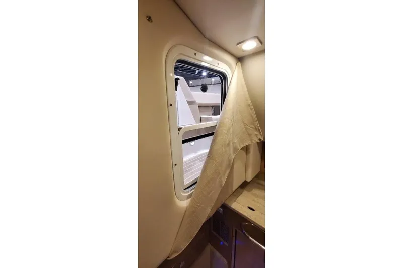  Yacht Photos Pics Interior view of 2017 Formula 350 Crossover Bowrider cabin window with curtain.