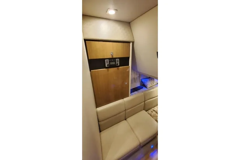  Yacht Photos Pics 2017 Formula 350 Crossover Bowrider interior with beige seating and wooden cabinetry.