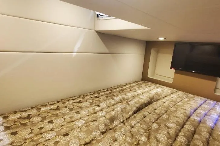  Yacht Photos Pics 2017 Formula 350 Crossover Bowrider cabin with bed and TV, featuring modern interior design.