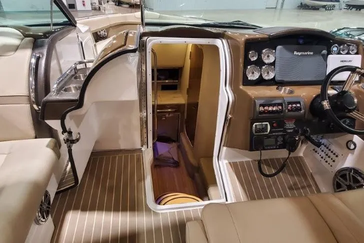  Yacht Photos Pics 2017 Formula 350 Crossover Bowrider interior with helm, cabin entrance, and modern controls.