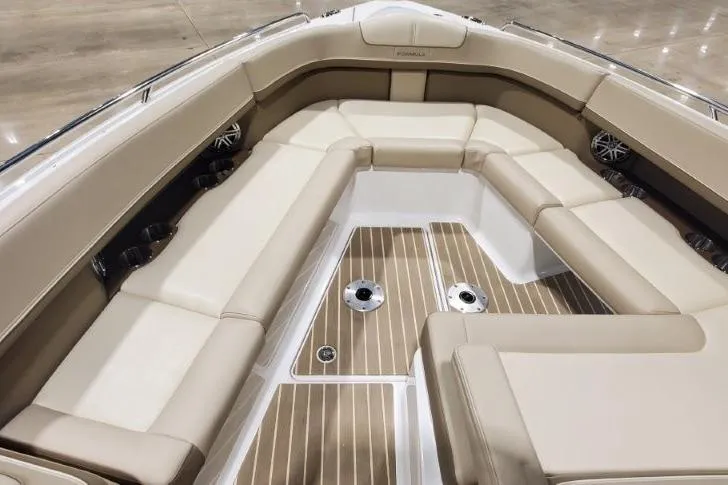  Yacht Photos Pics 2017 Formula 350 Crossover Bowrider interior with beige seating and wood-style flooring.