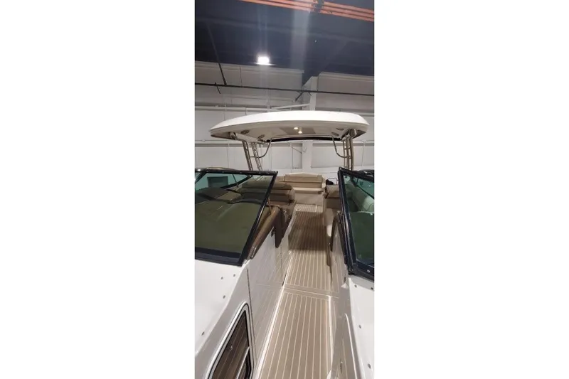  Yacht Photos Pics 2017 Formula 350 Crossover Bowrider interior with seating and canopy in a showroom.
