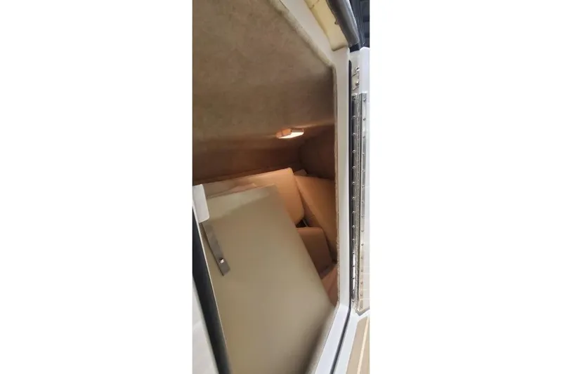  Yacht Photos Pics 2017 Formula 350 Crossover Bowrider cabin interior with beige upholstery and lighting.