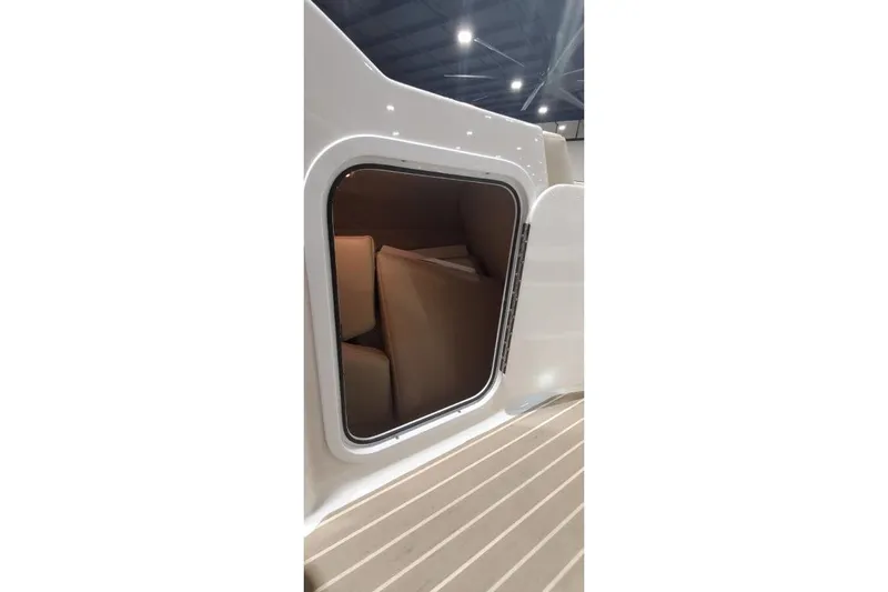  Yacht Photos Pics 2017 Formula 350 Crossover Bowrider storage compartment with open hatch, showcasing interior space.