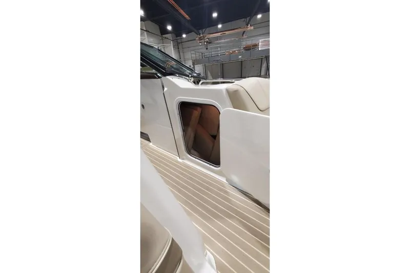  Yacht Photos Pics 2017 Formula 350 Crossover Bowrider interior with open storage compartment in a well-lit showroom.