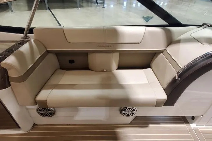  Yacht Photos Pics 2017 Formula 350 Crossover Bowrider interior seating with beige upholstery and integrated speakers.