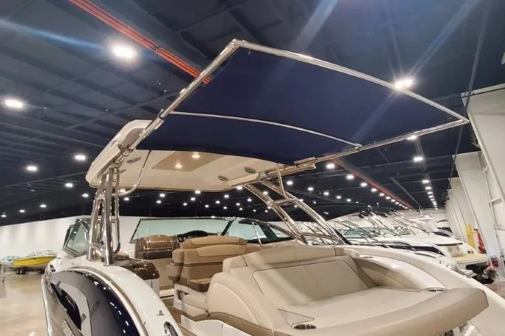  Yacht Photos Pics 2017 Formula 350 Crossover Bowrider with canopy in a showroom setting.