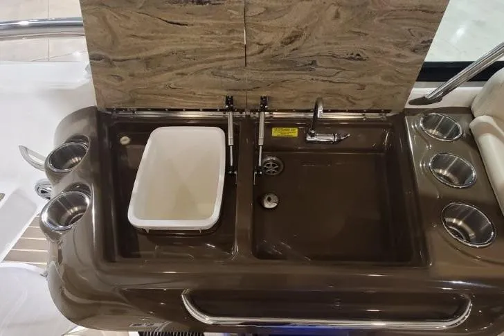 Yacht Photos Pics 2017 Formula 350 Crossover Bowrider sink area with cup holders and marble backsplash.