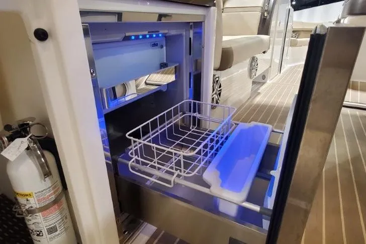  Yacht Photos Pics 2017 Formula 350 Crossover Bowrider interior with open drawer and fire extinguisher.