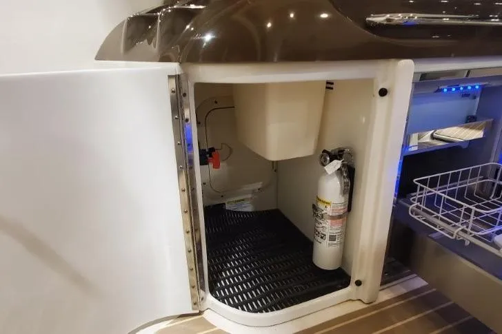  Yacht Photos Pics 2017 Formula 350 Crossover Bowrider storage area with fire extinguisher and shelving.
