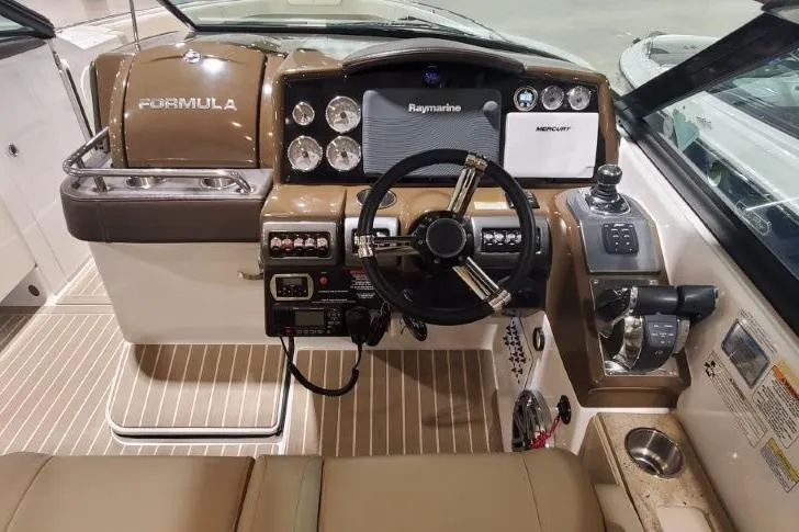 Yacht Photos Pics 2017 Formula 350 Crossover Bowrider dashboard with steering wheel and navigation controls.