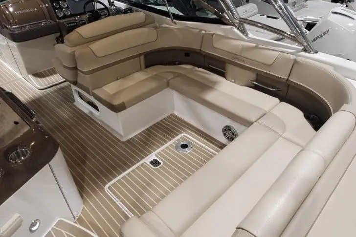  Yacht Photos Pics Luxurious interior of 2017 Formula 350 Crossover Bowrider with beige seating and wood flooring.