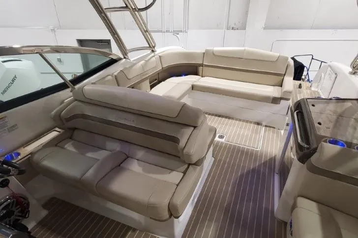 Yacht Photos Pics 2017 Formula 350 Crossover Bowrider interior with beige seating and wood flooring.