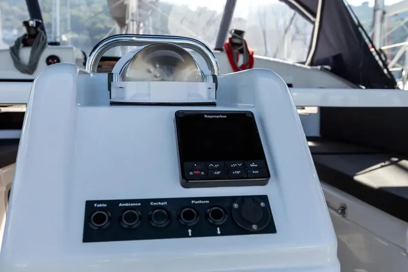  Yacht Photos Pics Cockpit controls of 2021 Jeanneau Sun Odyssey 410 sailboat, featuring navigation equipment.